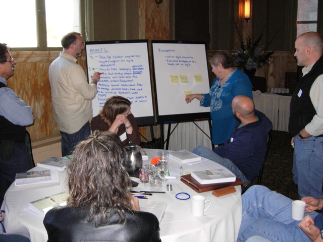 A picture of Diana Larsen working with a small group.